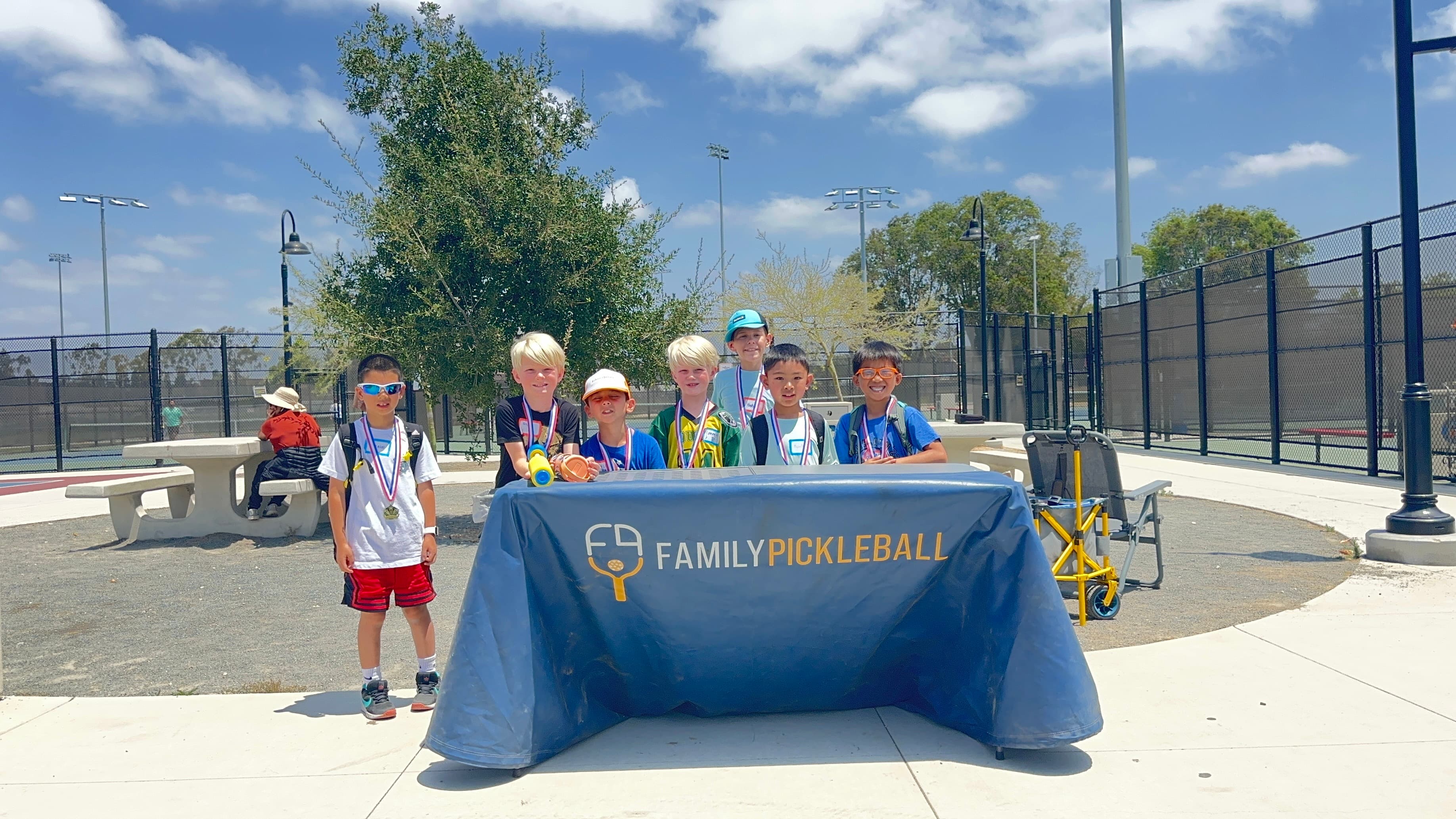 The FpB Pickleball booth welcomes players at an outdoor event.
